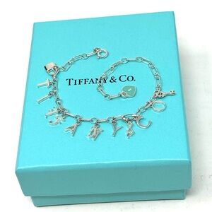 Authentic Tiffany & co. Enamel Blue Tag Heart  Note Logo Bracelet.